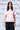 Women coral peach graphic t-shirt with heart motif, designer casual wear UAE