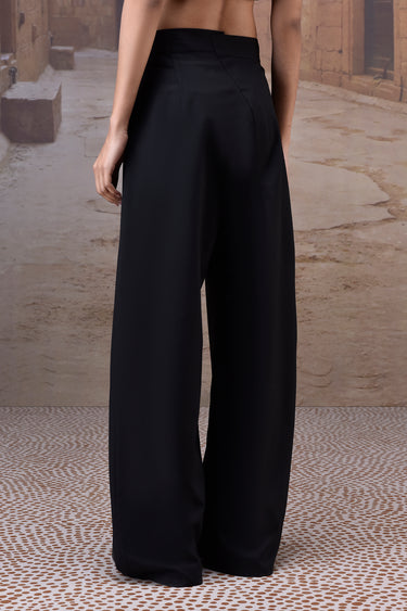 Black relaxed trousers for women in poly wool fabric by Genes Lecoanet Hemant UAE