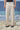 Beige relaxed fit cotton lycra trousers for men by Genes Lecoanet Hemant India