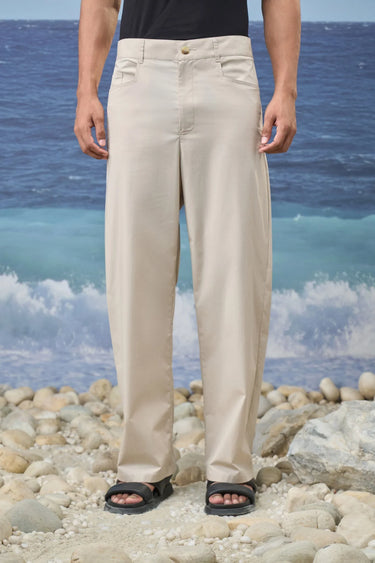 Beige relaxed fit cotton lycra trousers for men by Genes Lecoanet Hemant India