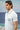 Blue poly viscose lycra t-shirt for men showing smooth stretch fabric texture