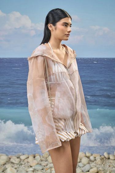 Luxury beige hoodie with abstract cloud motif and oversized silhouette