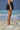 Black poly viscose skirt for women showing breathable smooth fabric texture