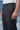 Black poly viscose trousers for men showing smooth breathable fabric texture