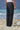 Black trousers for men with clean waistband and minimal detailing