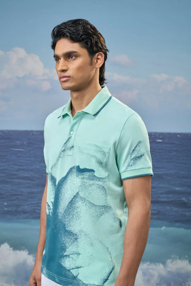 Stylish mint green polo t-shirt for men with dotted print, modern designer wear