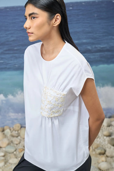 White sleeveless top for women with clean neckline and refined finish